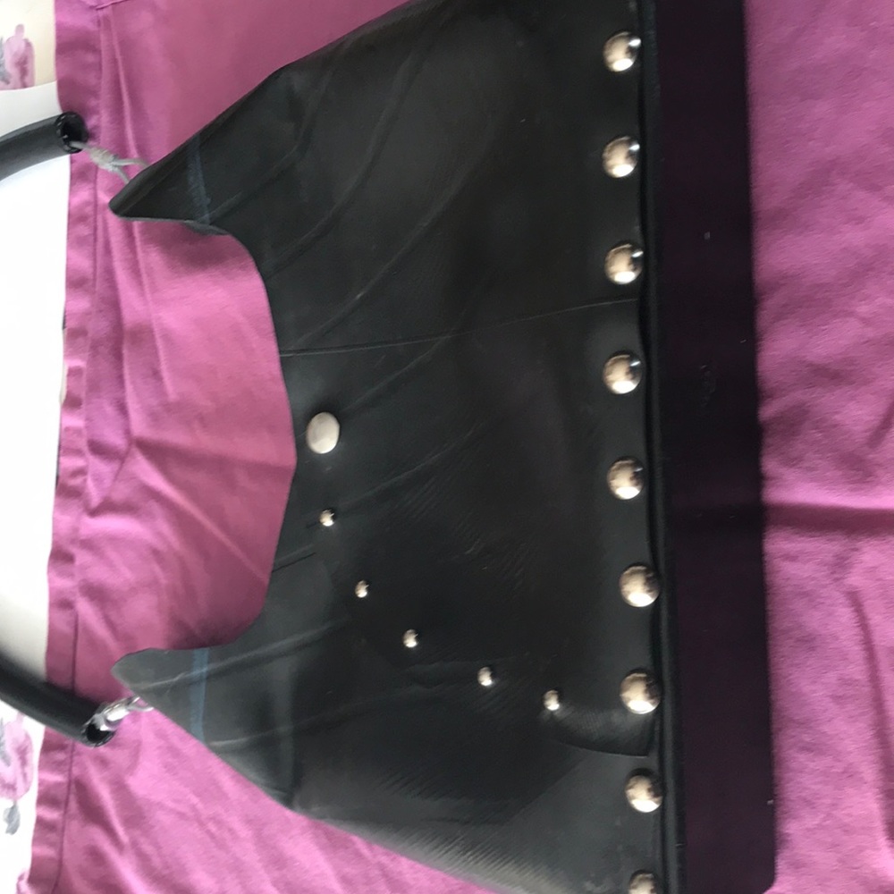 Up-cycle handbag made from repurposed tires.